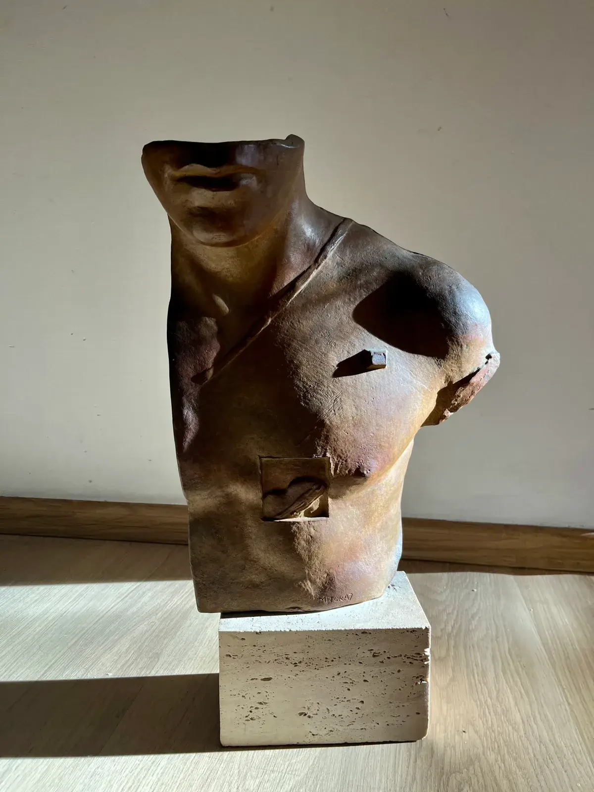 Asclépios (1988) — Igor Mitoraj, green patina bronze torso, signed MITORAJ, travertine base, Ed. 1000