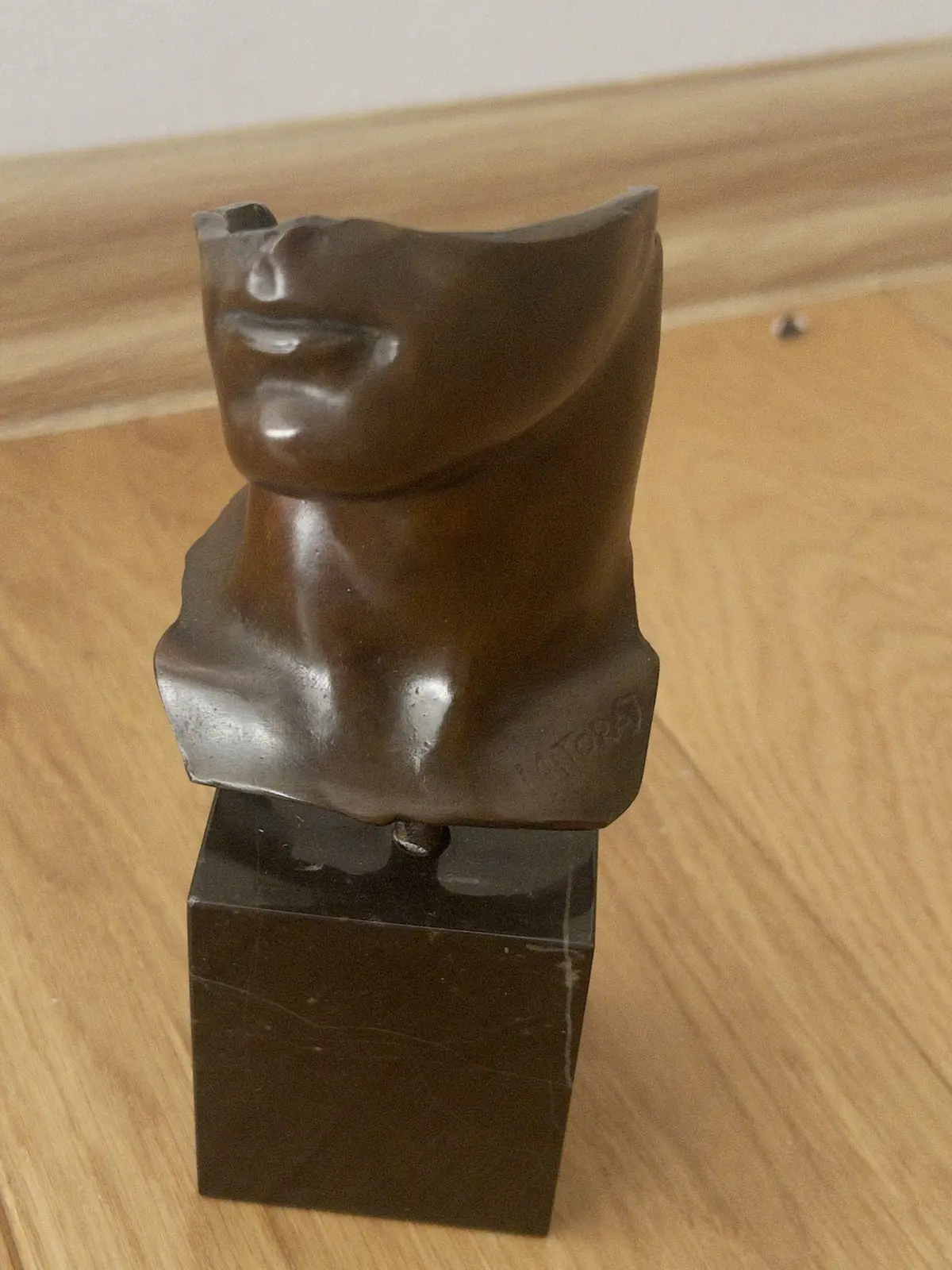 Portrait d'Homme (1984) — Igor Mitoraj, bronze, raised three-quarter view with MITORAJ signature incised at lower right