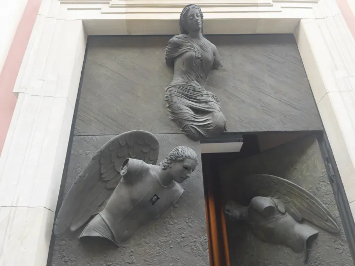 Mitoraj Warsaw Jesuit church — doorway view